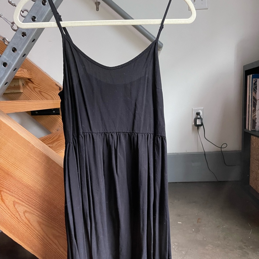 Thin strap, black old navy dress. Super flowy and comfortable.